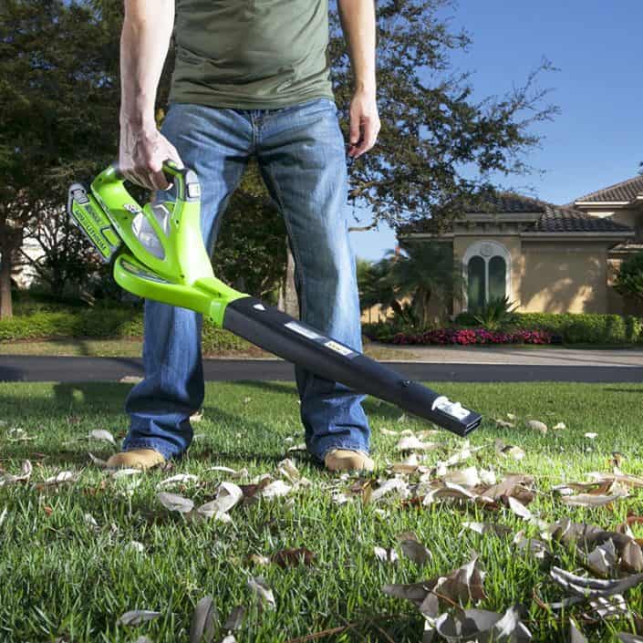 Best-Cordless-Leaf-Blower-Mulcher clearing leaves on lawn