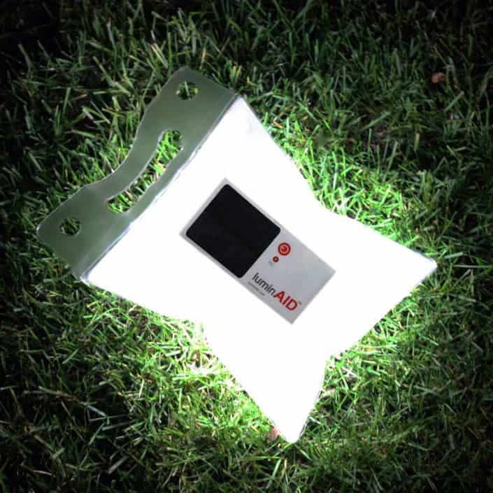 LuminAID Solar Inflatable Light shown on grass lawn